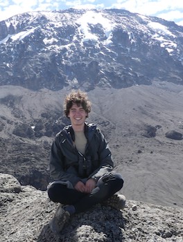 Portrait of MILSA participant Valentin Moser in front of a mountain scenery